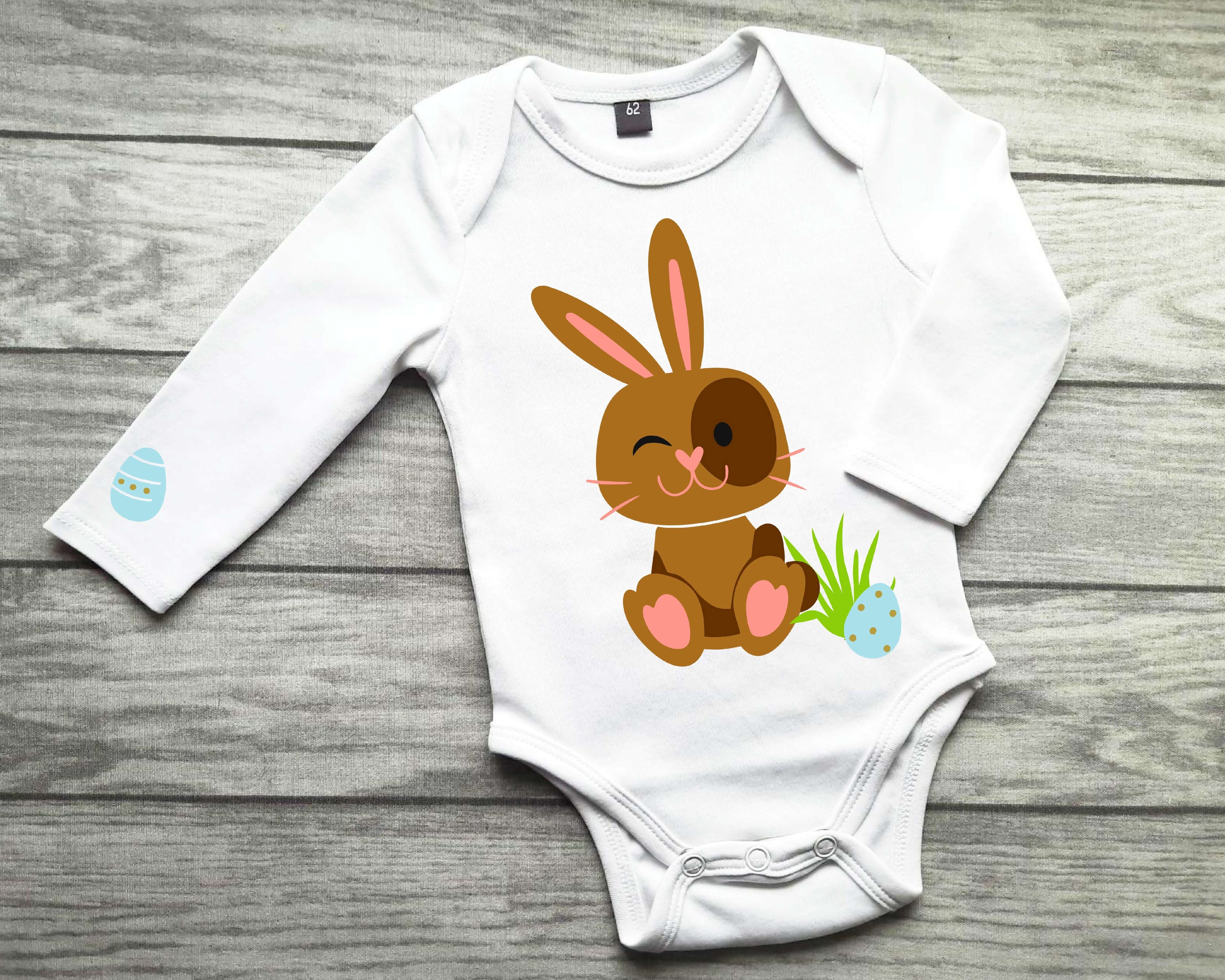weißer Babybody mit Osterhase für Ostern in hellbraun und hellblaue Eier, mit gold metallic Effekt