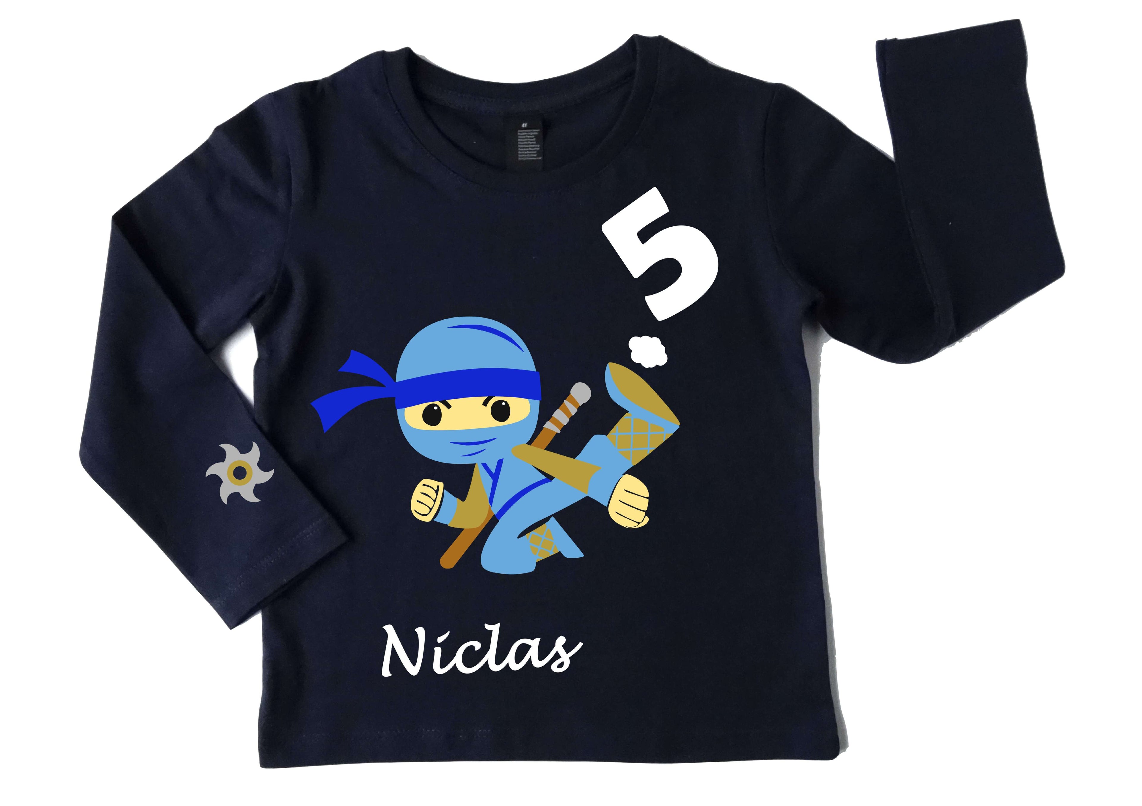 navi Geburtstagsshirt für Kinder mit hellblauem, springendem Ninja, Name und Zahl, mit gold metallic, mit langem Arm