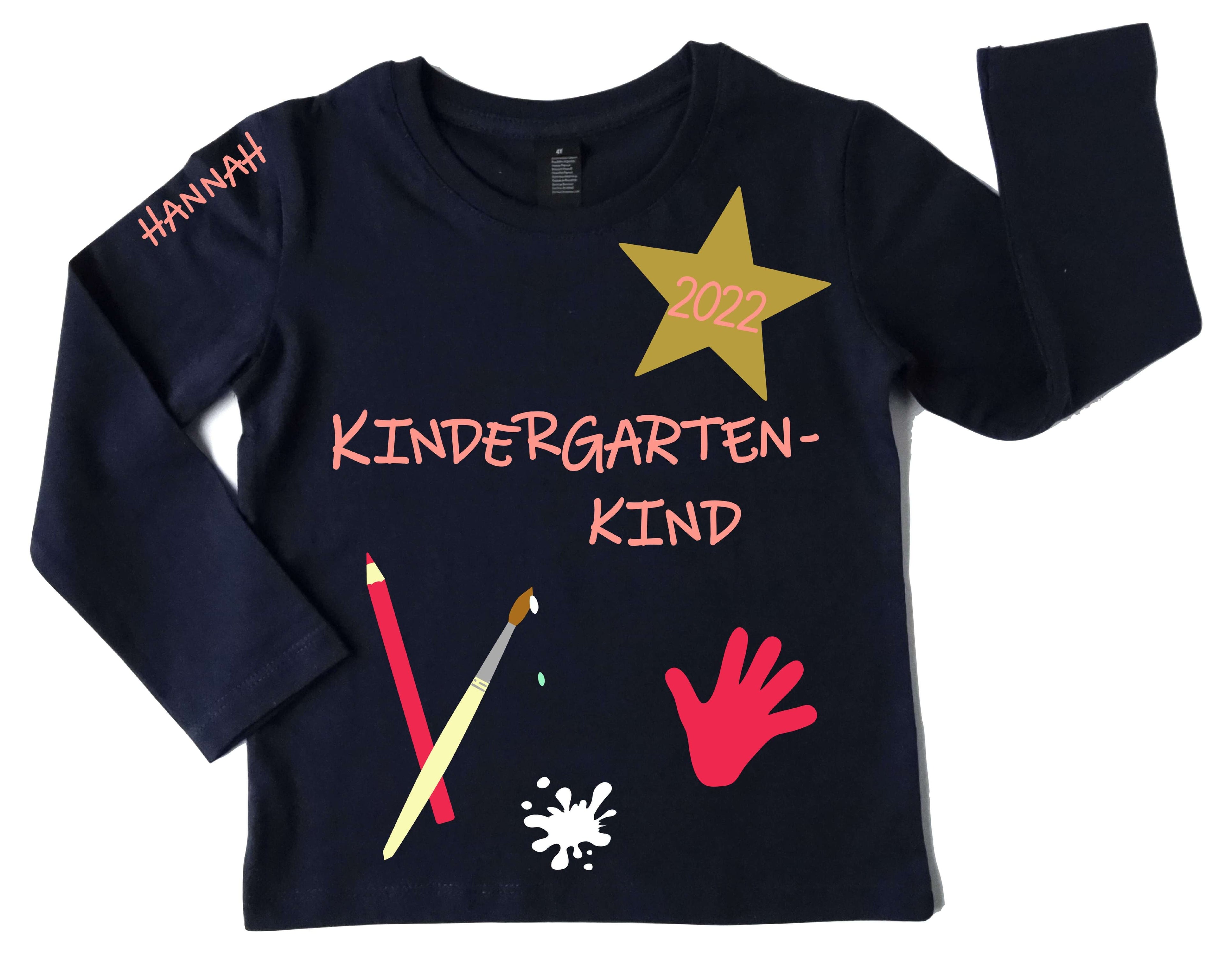 navi Kindergartenshirt mit 
Name und Jahreszahl, pink rosa Aufdruck mit schimmerndem gold