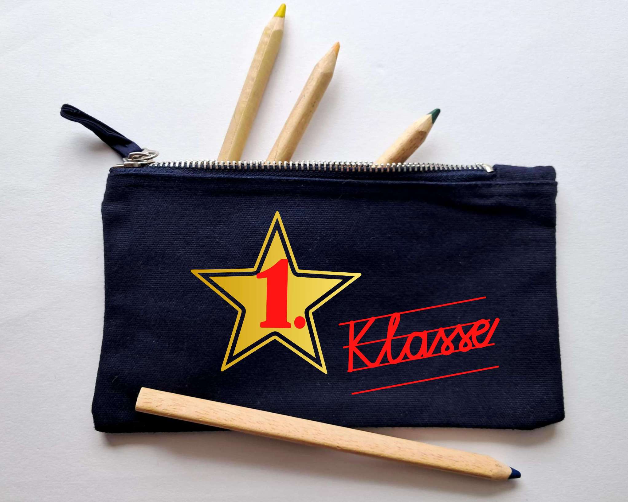 navy Stiftemäppchen mit Reißverschluss, bedruckt mit 1. Klasse in Schreibschrift in rot und gold metallic Stern