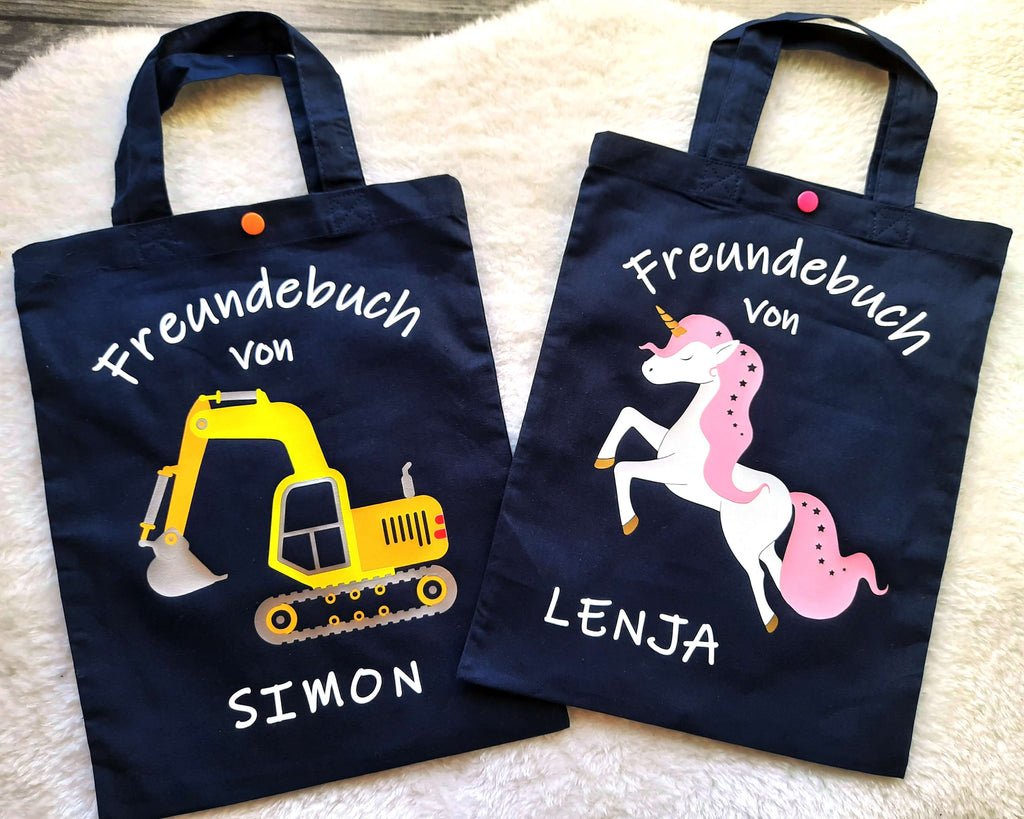 navi Freundebuchtaschen für Kinder mit Bagger und Einhorn und Name bedruckt, aus Baumwolle mit Druckknopf