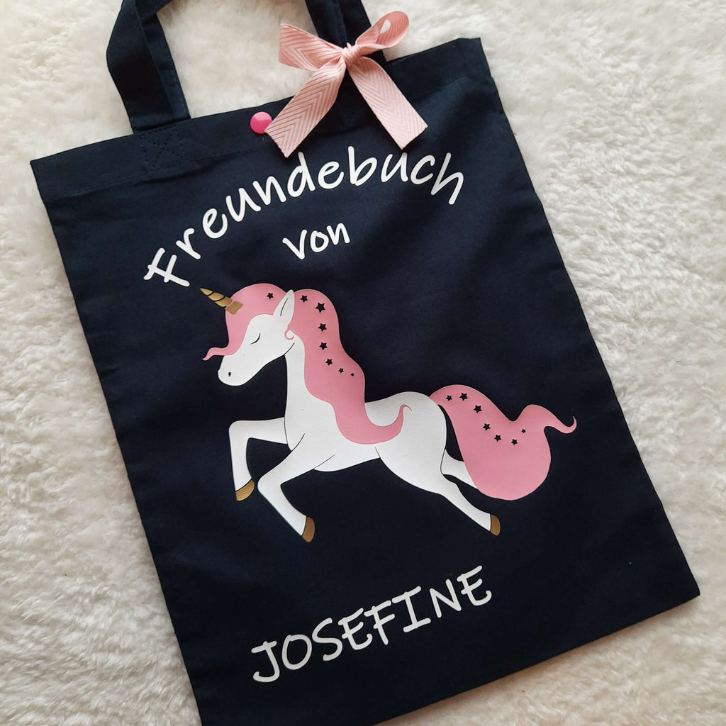 navi Freundebuchtasche für Kinder mit weißem Einhorn und Name bedruckt, aus Baumwolle mit Druckknopf